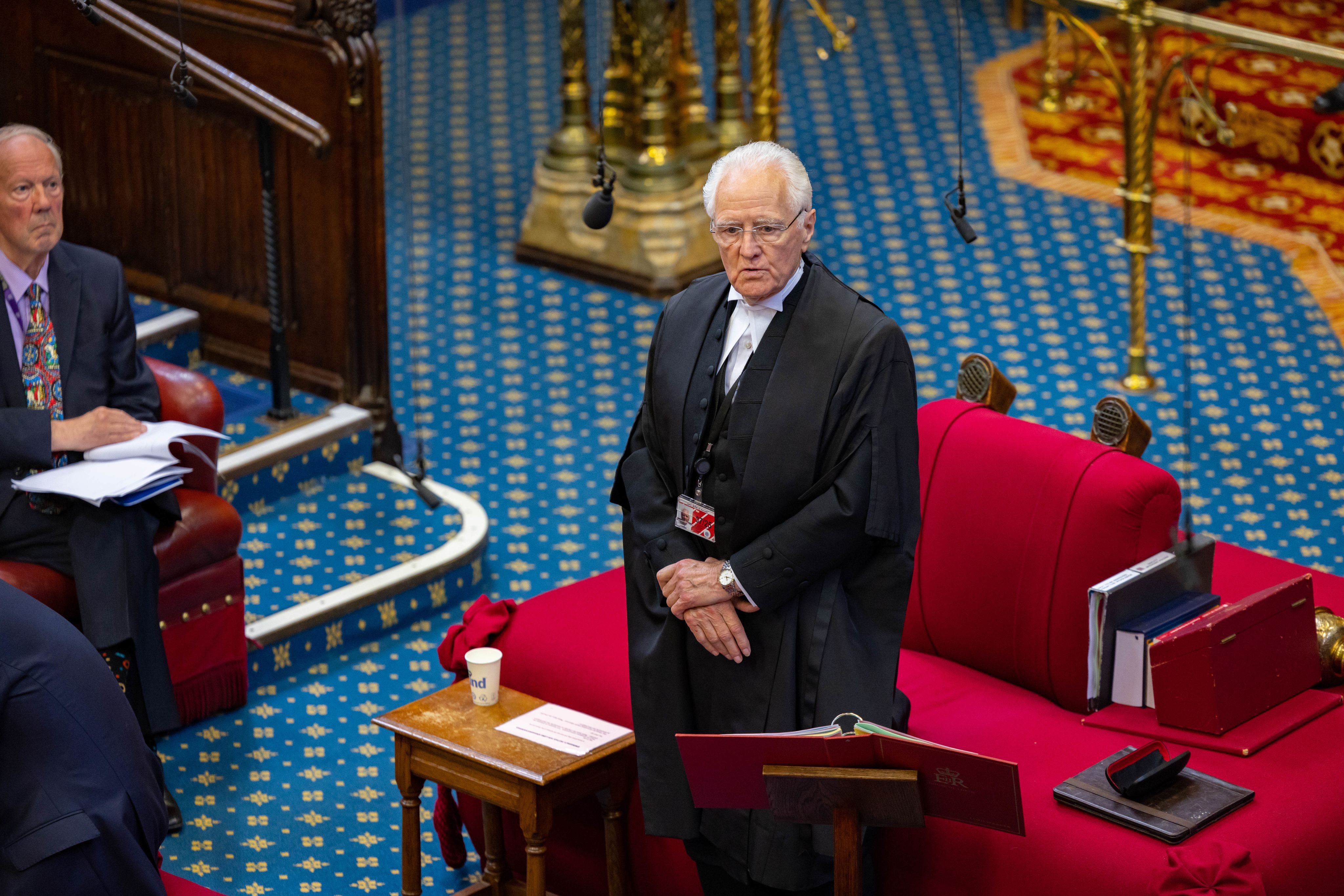 The Lord Speaker stands to speak from the woolsack in the House of Lords chamber