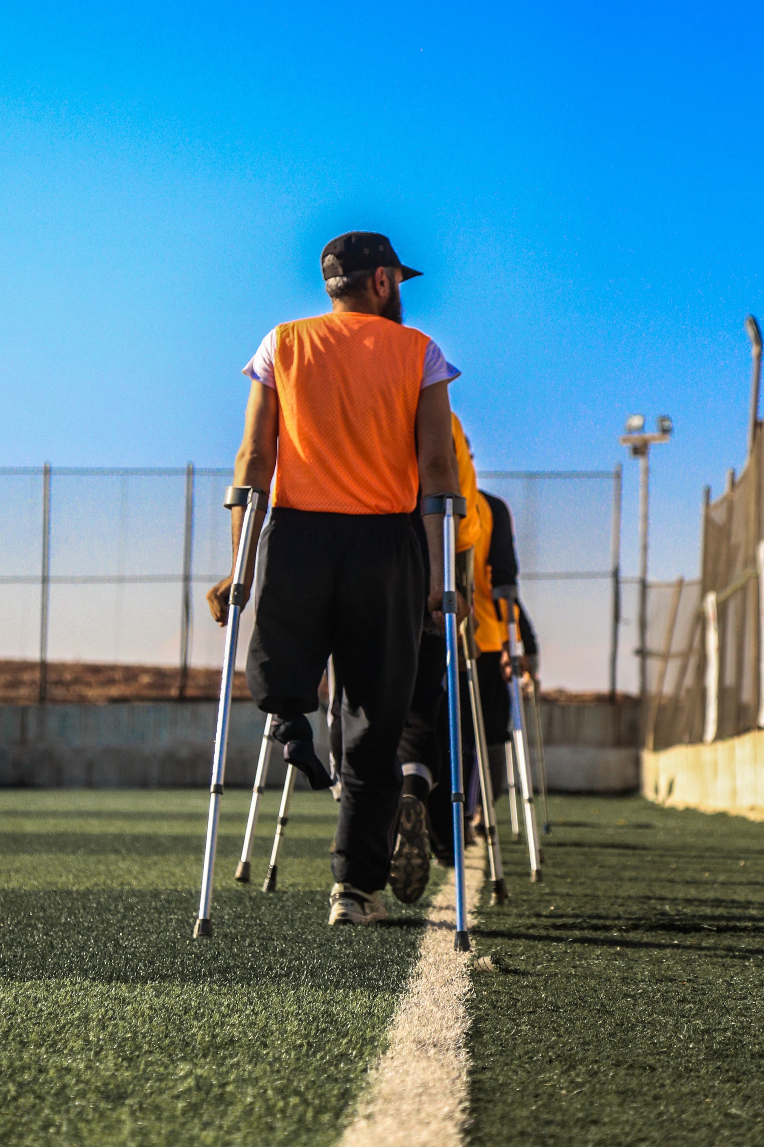 decorative image of group of paraplegics on a football pitch