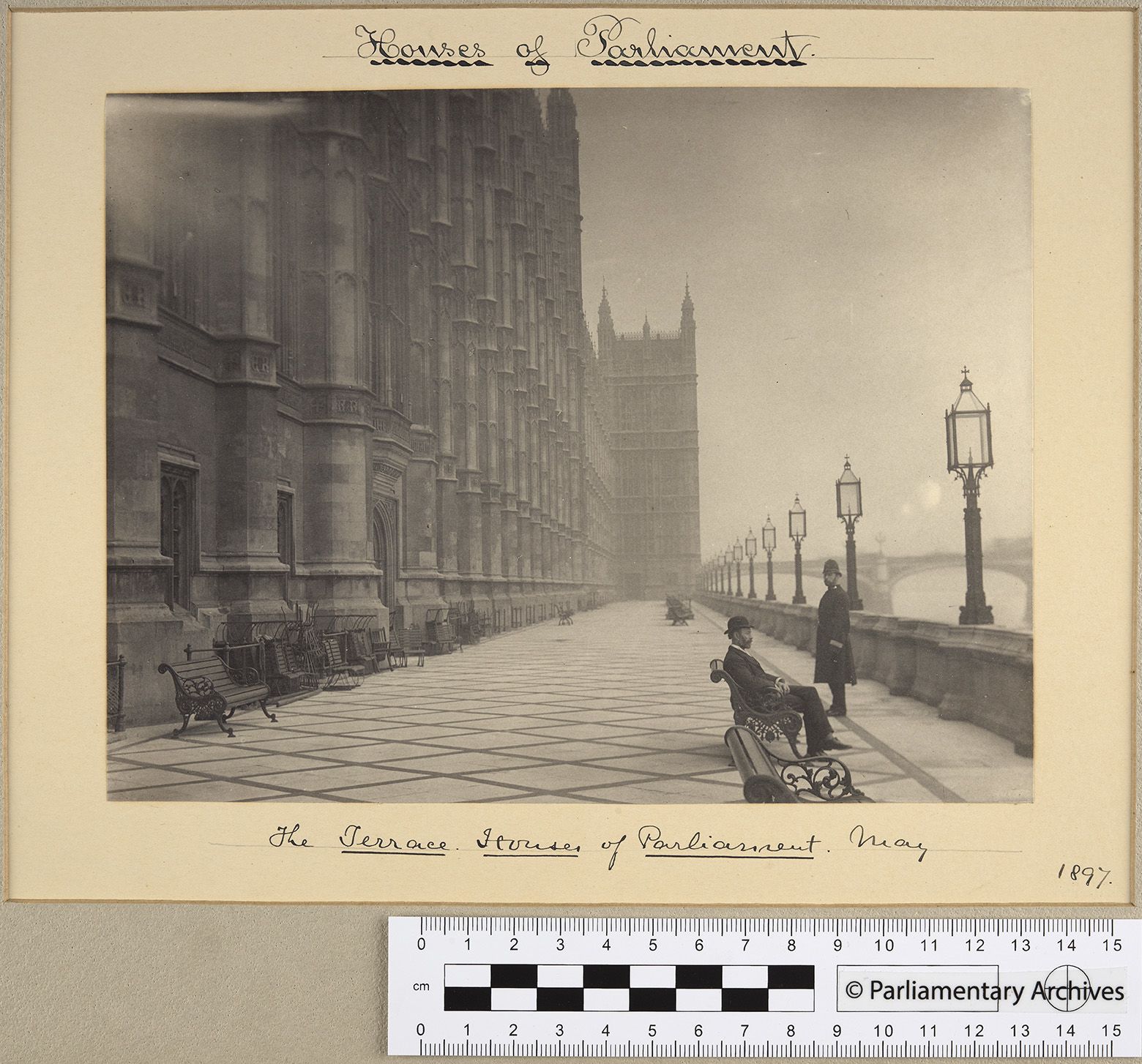 black and white photograph featuring two men on the terrace