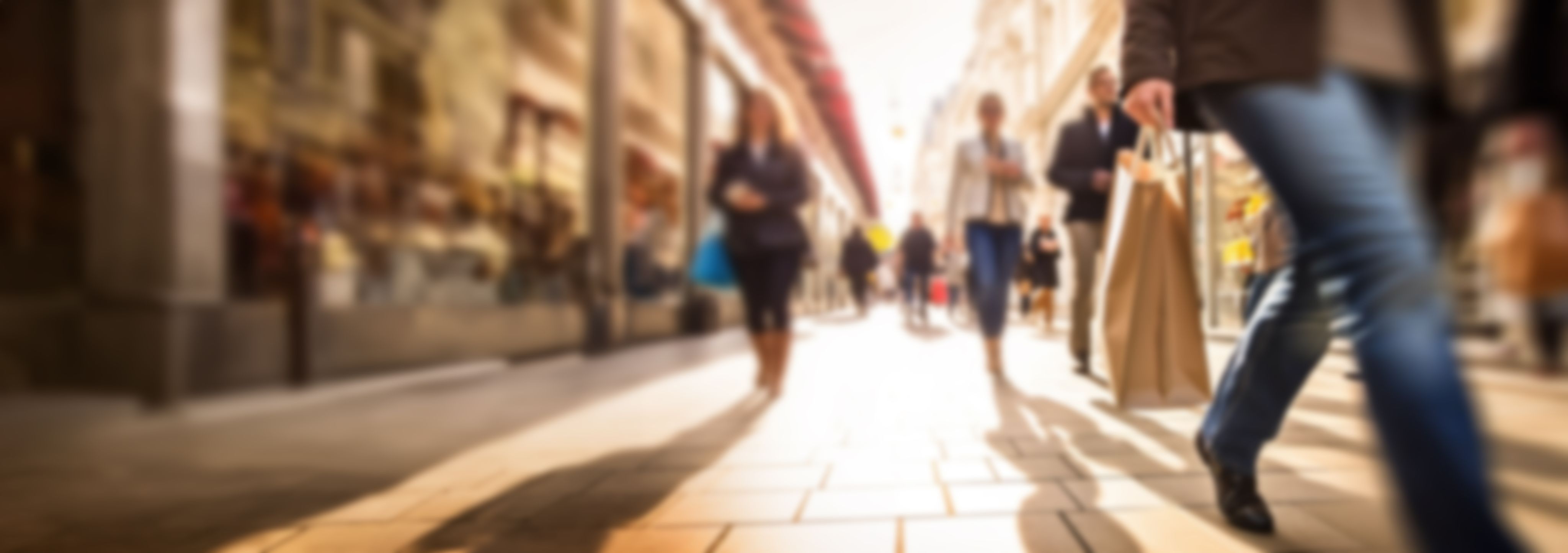 Pedestrianised street with people shopping