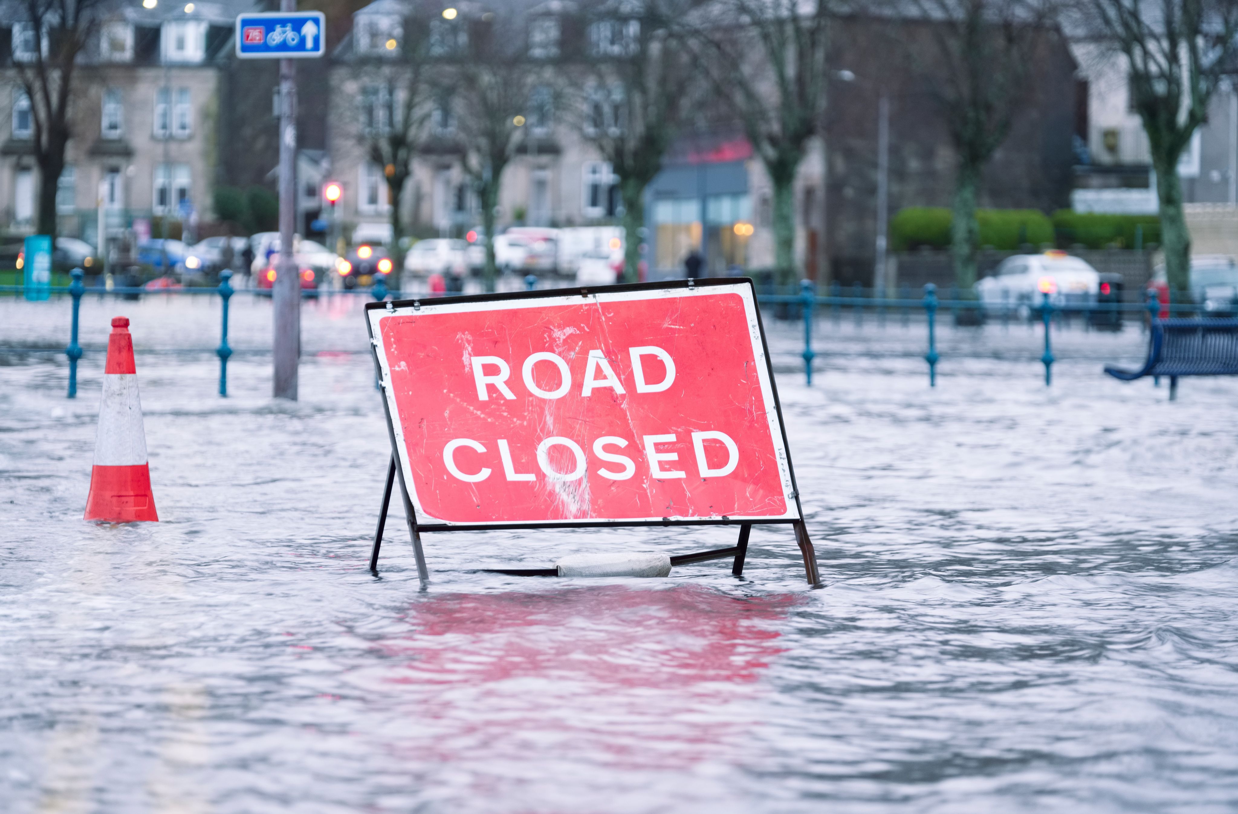 Road closed sign on a flooded street