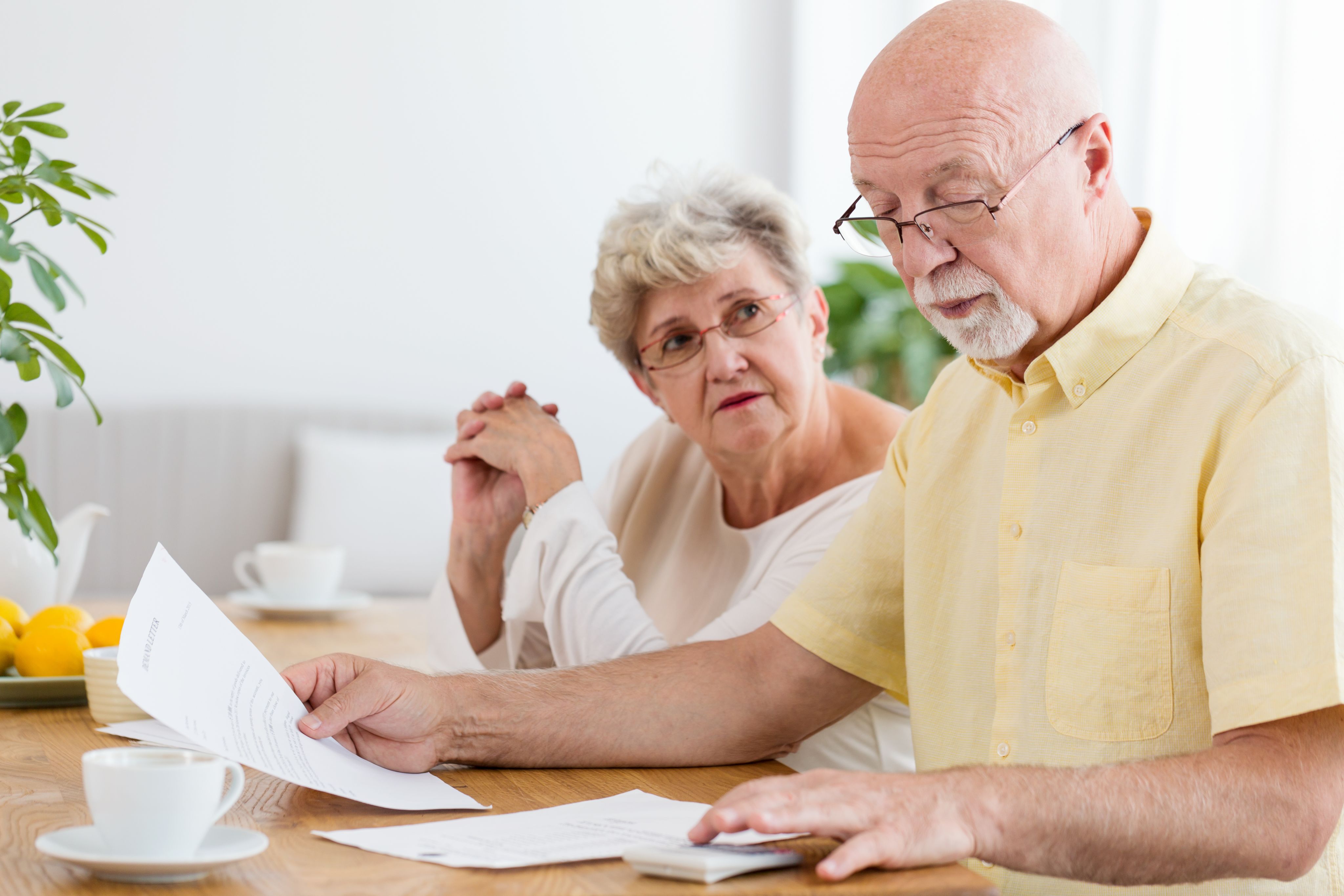 Older couple look through paperwork