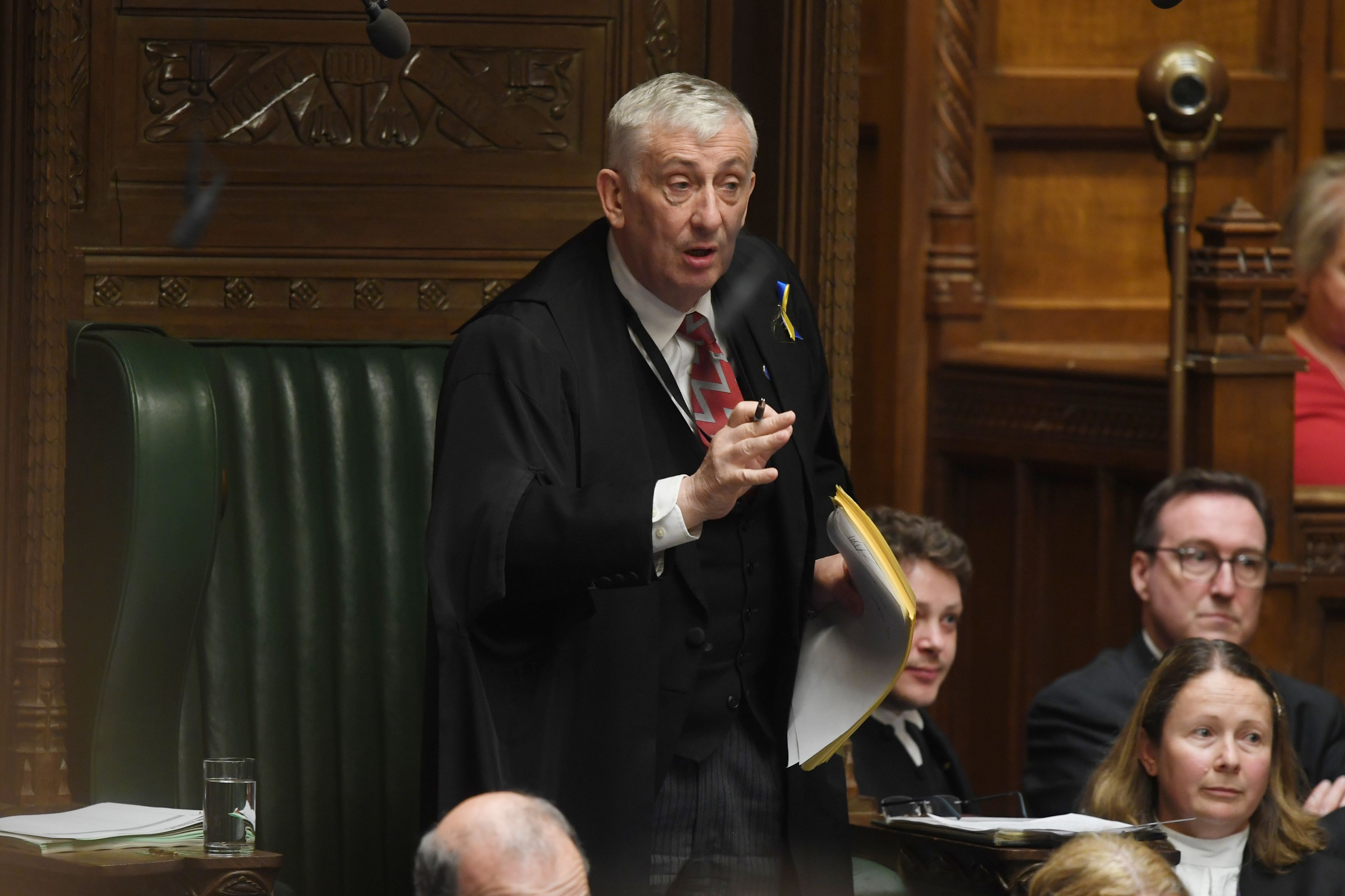 Speaker standing from Chair