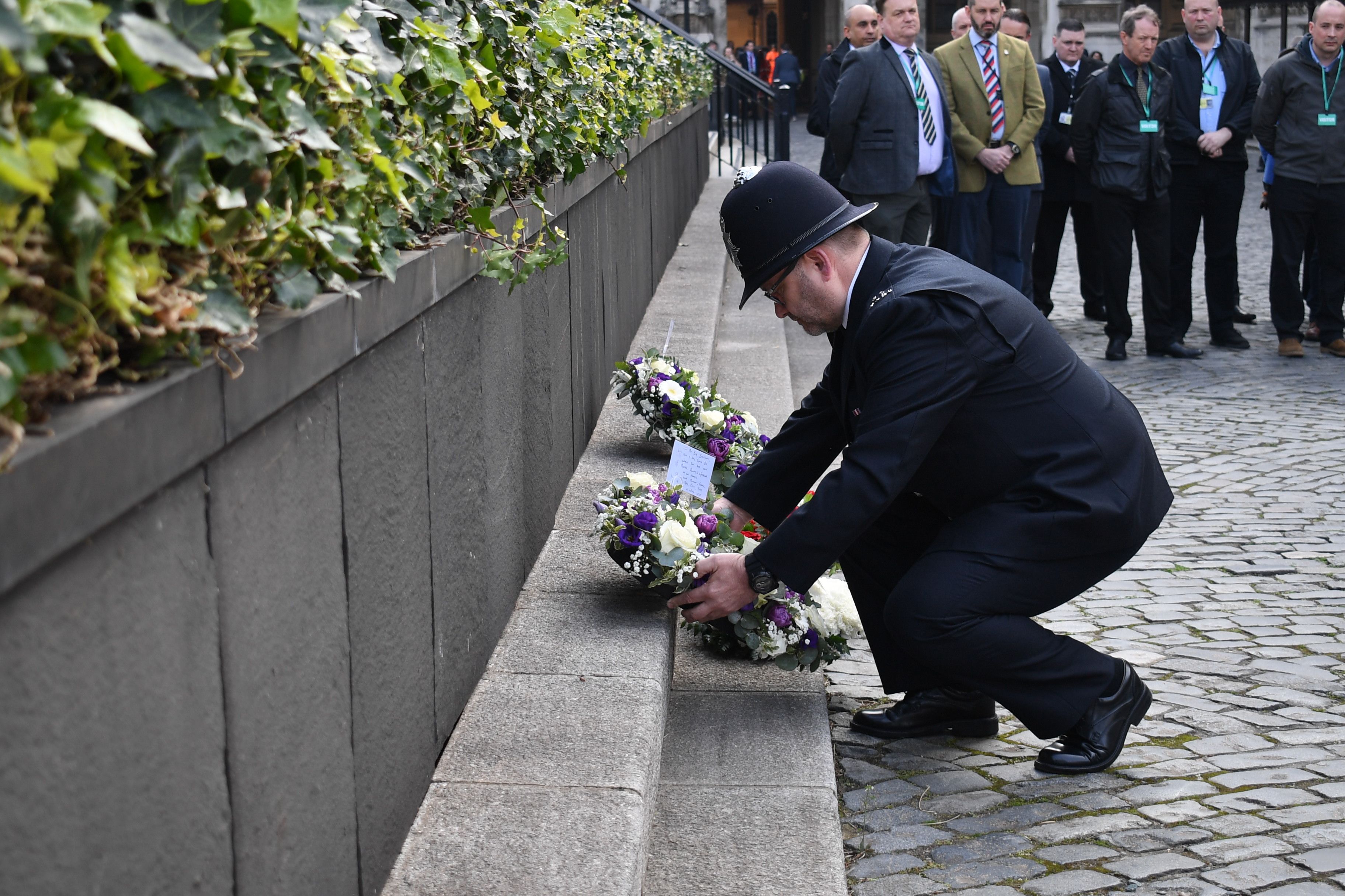 Police Officer lays wreath