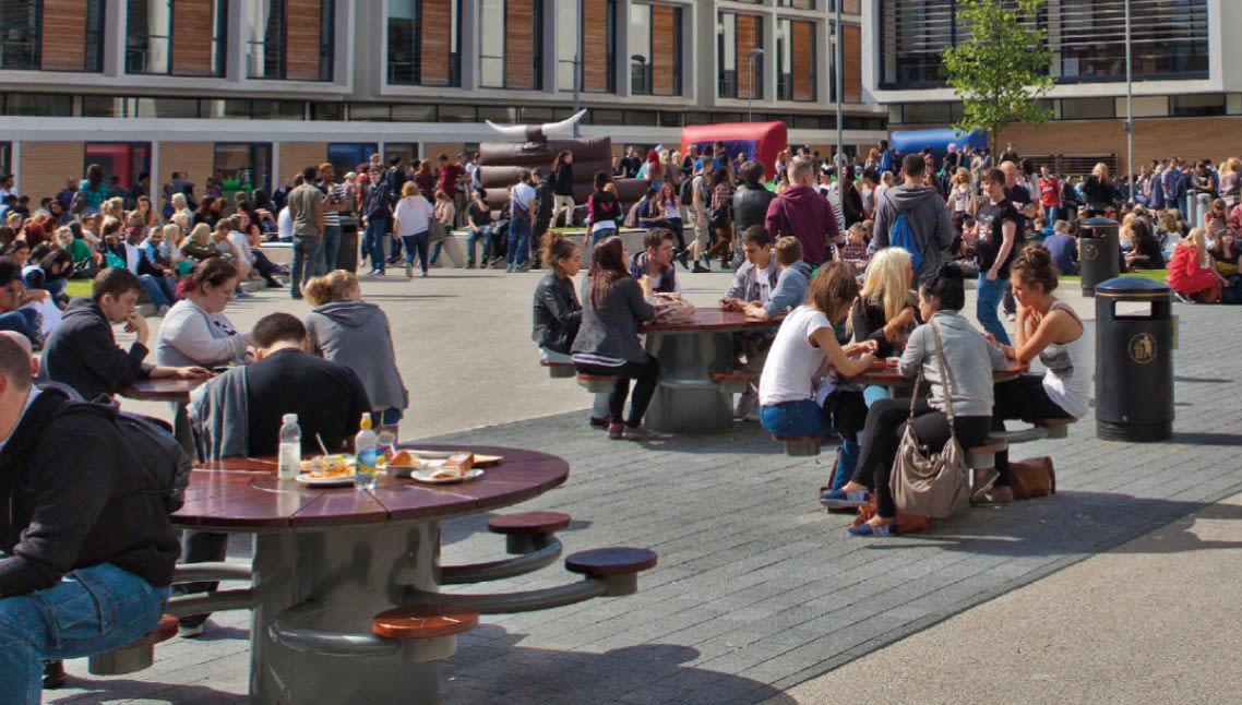 Picture of Trafford College students sitting outside