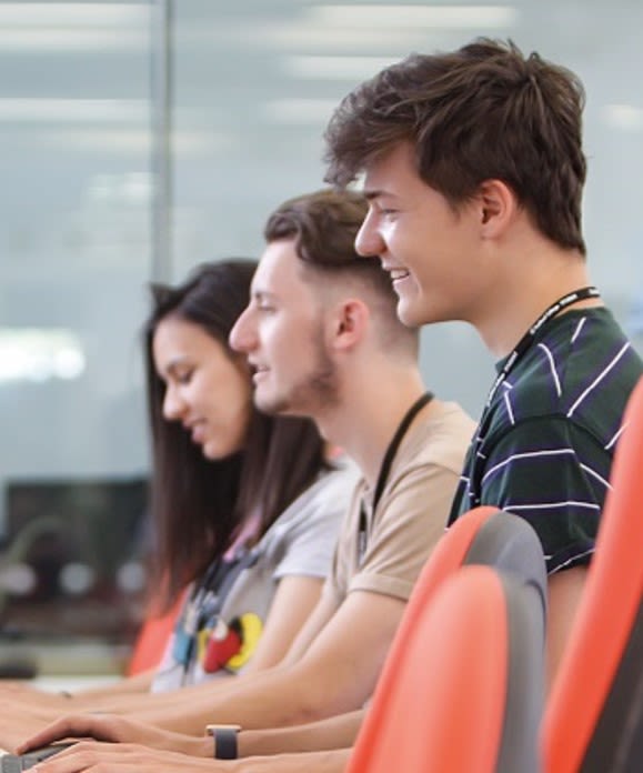 Picture of college students working on laptops 