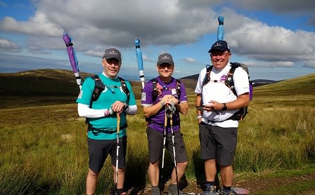 Image of the 3 Dads Walking, Mike, Andy and Tim, standing in a field on one of their walks.