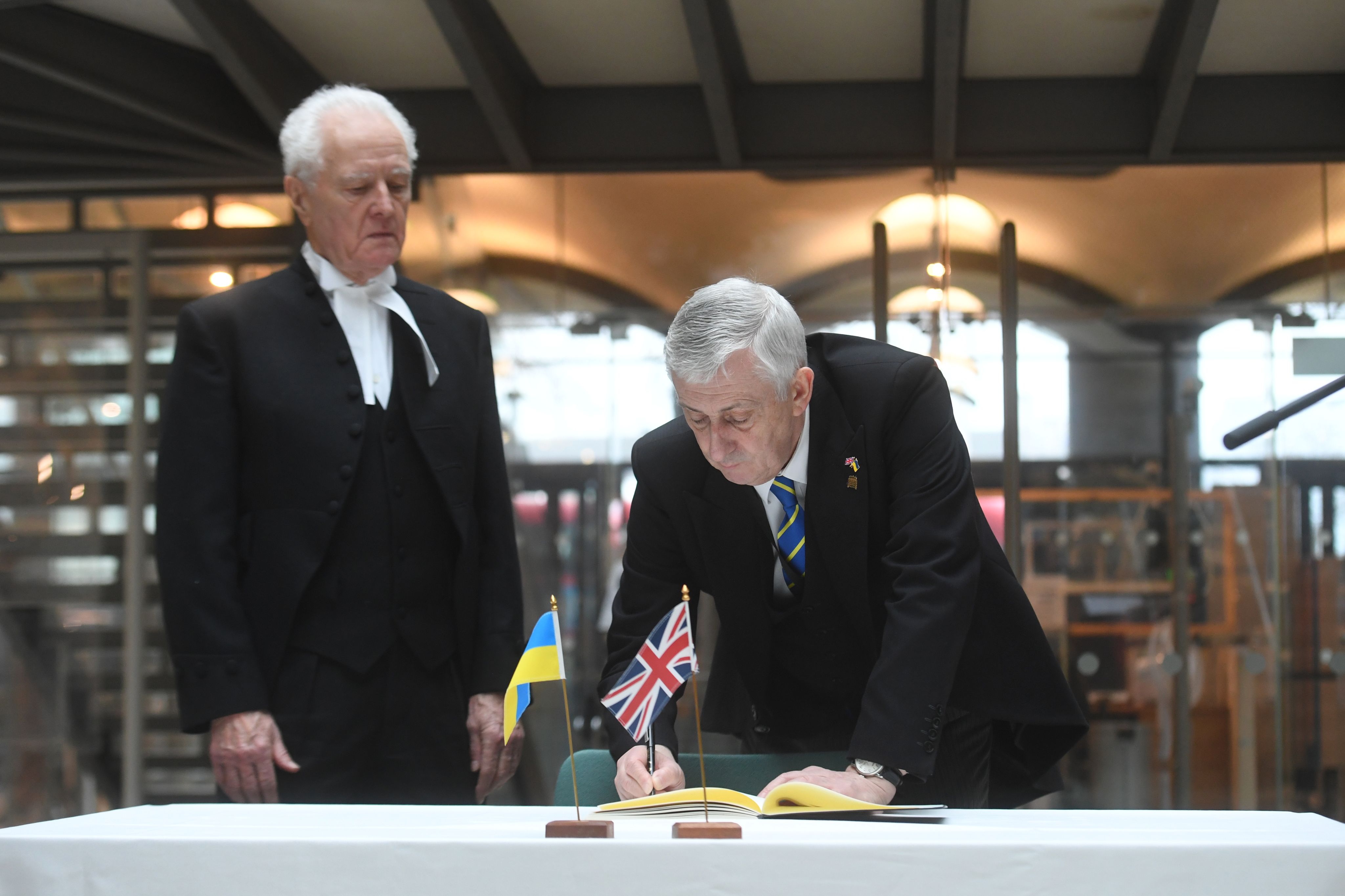 Speaker Hoyle and Lord Speaker signing Book of Solidarity